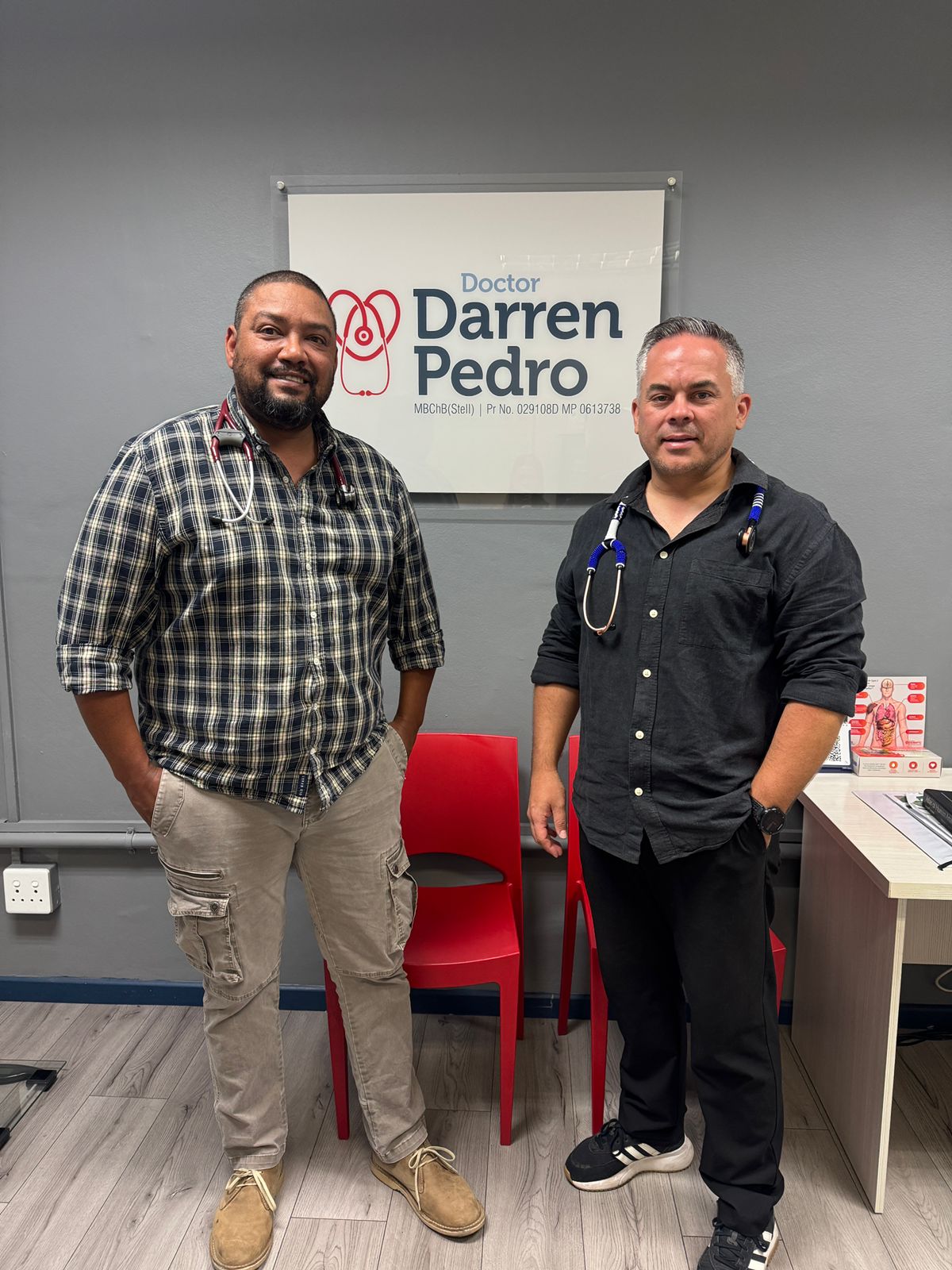 Dr. Pedro and Dr. Adams at the practice